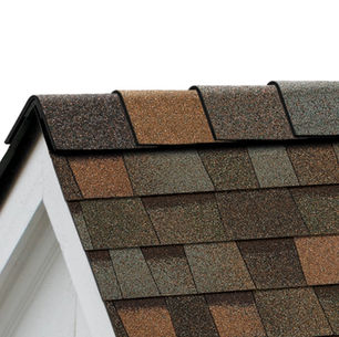 Cape Cod style home with an Owens Corning Aged Copper brown shingle roof and painted shutters