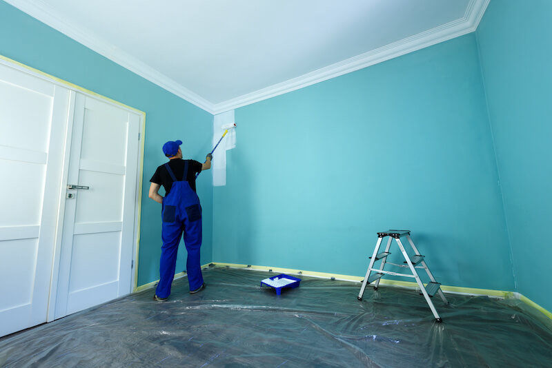 Professional contractor reviewing remodeling project timeline and schedule with homeowners during planning consultation