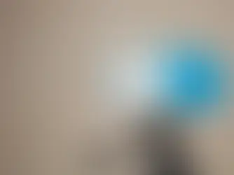 Home inspector placing radon test device in Pittsburgh PA basement during home inspection