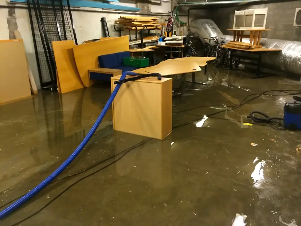 Flooded basement after heavy rain in North Huntingdon PA showing water seeping through foundation wall