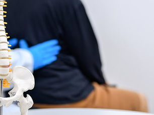 Chiropractor performing a spinal adjustment for drug-free pain relief at a family chiropractic office in Monroeville PA