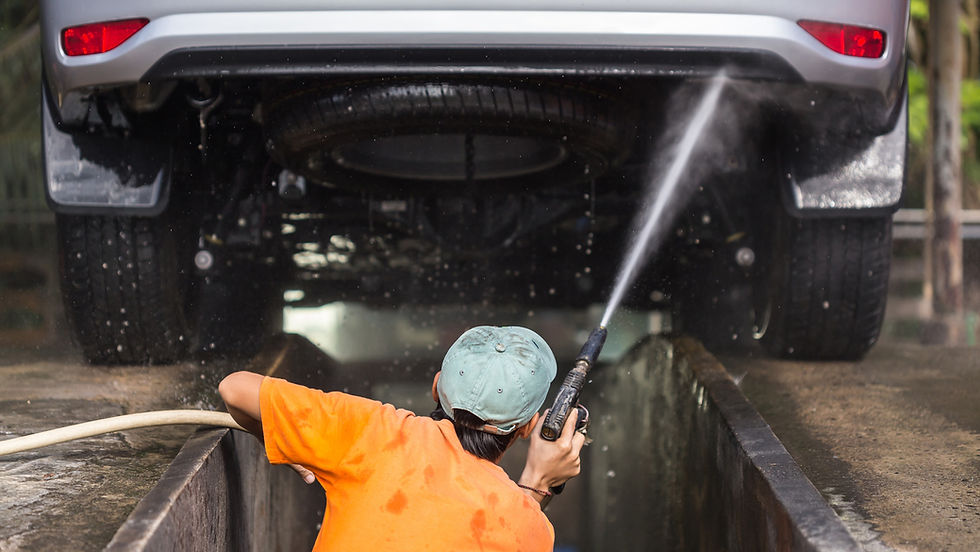 Professional undercarriage cleaning services removing road salt from vehicle underbody at Western Pennsylvania car wash