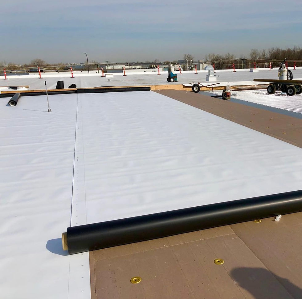 TPO roofing membrane installation on flat roof showing white reflective surface and professional installation techniques
