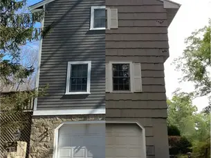 Closeup of worn vinyl siding on a Pittsburgh PA home showing cracks and warping before replacement