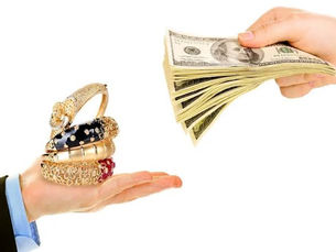 Customer presenting gold jewelry for a pawn loan assessment at a pawn shop in Greensburg, PA