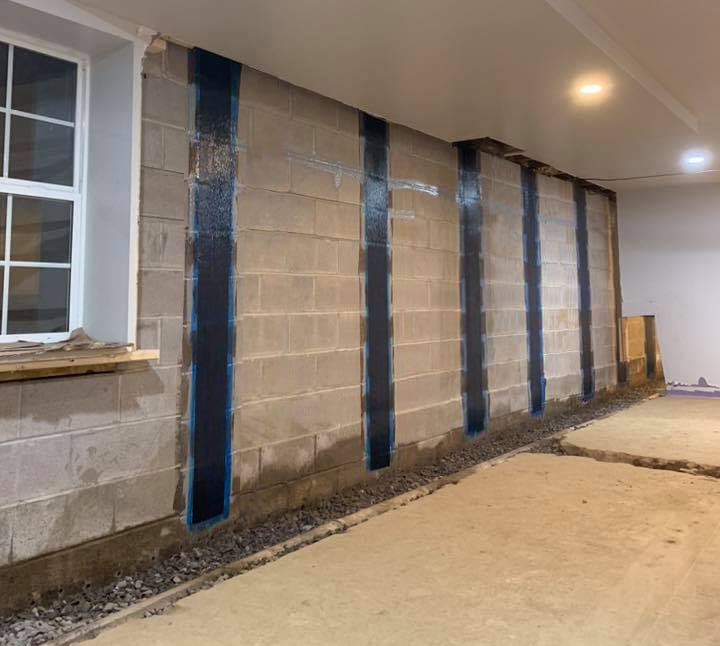 Carbon fiber strapping reinforcement installed on basement foundation wall in North Huntingdon PA home