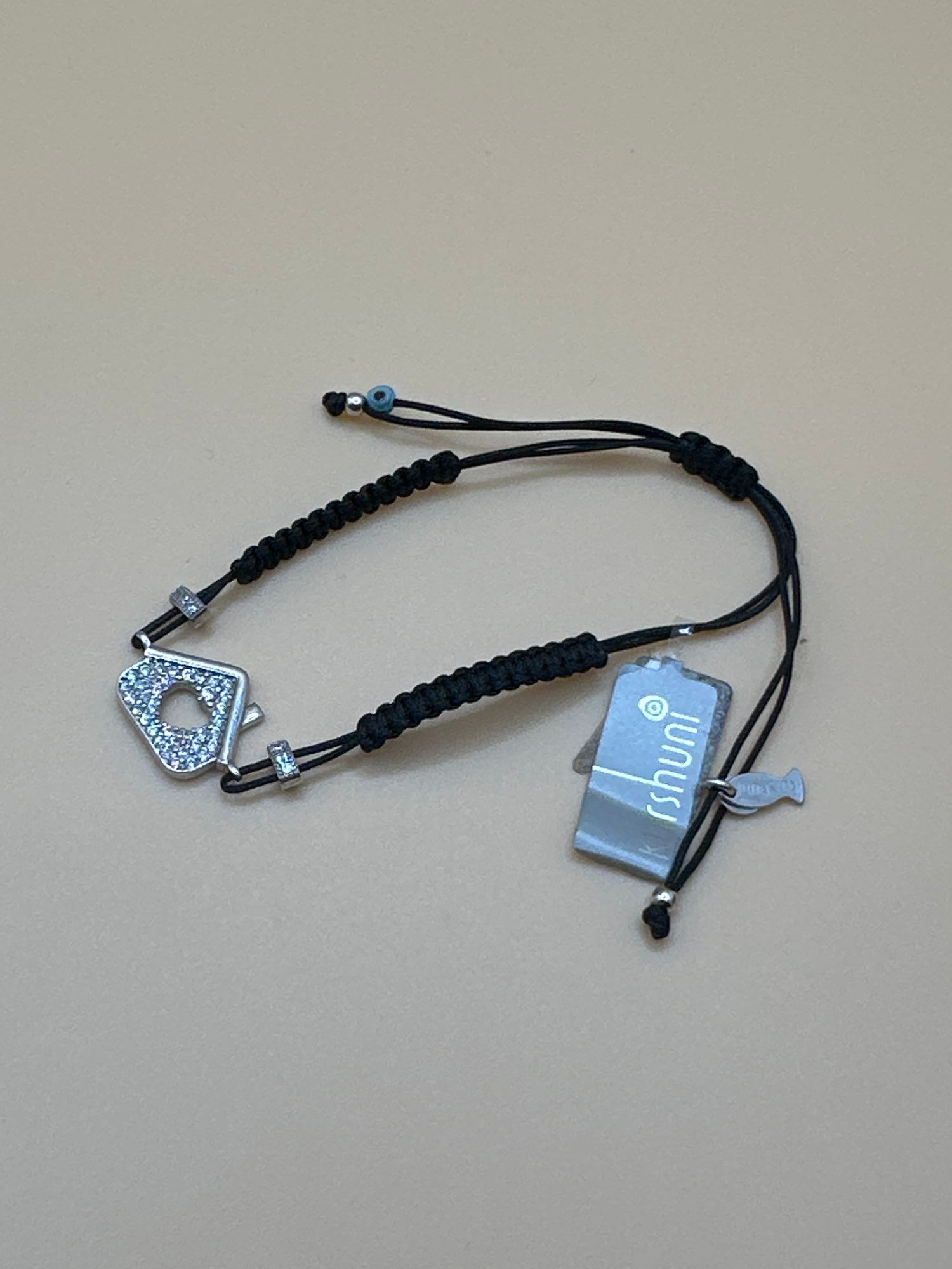 Bracciale Kurshuni Macramè Nero con Ciondolo Casina Zirconata e Occhio Turco