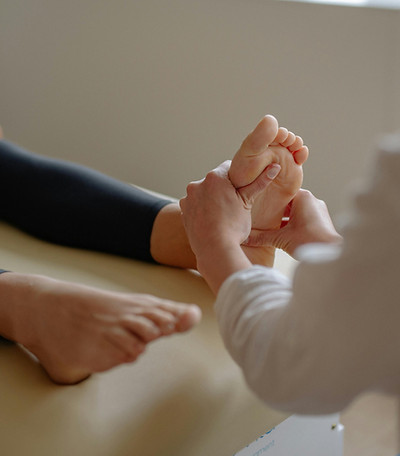 Reflexology treatment on the feet, which helps people to relax, improves circulation and reduces pain and inflammation