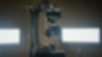"Side view of robotic arm with camera mounted for high-speed, repeatable video production in studio."