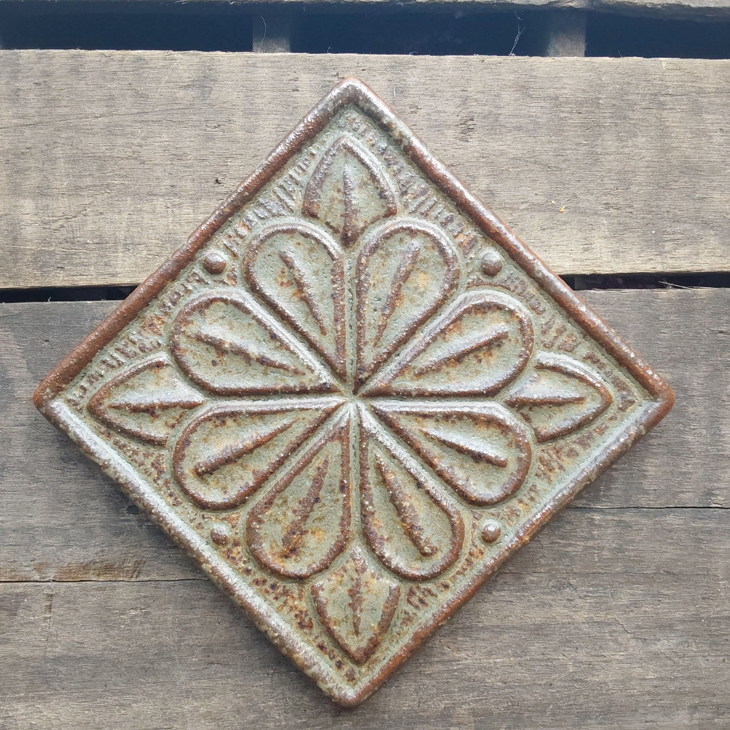 Foliate rose tile. Handmade, historical pattern. Green ash glaze 4x4