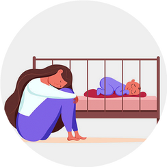 Traurige Frau vor Kinderbett
