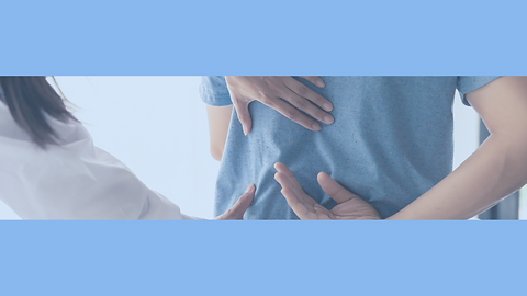 Dcotor inspecting a back