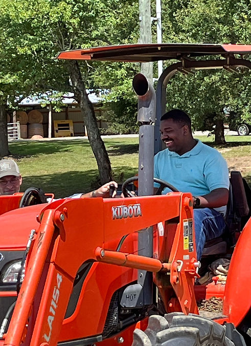Hero-Ag-Farming-Mentor-Trevor-Printup-driving-tractor