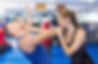 Young woman and her trainer are practicing captures on the self-defense course in gym.jpg