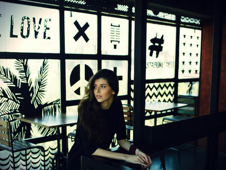 Woman sitting at a table in a coffee shop