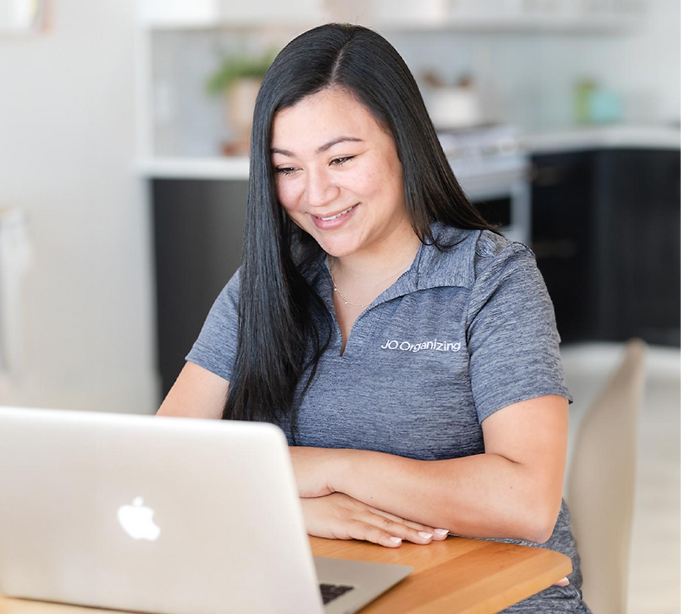 Johamy from JO Organizing smiling during a virtual home organizing consultation on a laptop. She is speaking with a client and helping create simple, family-friendly organizing solutions from home.