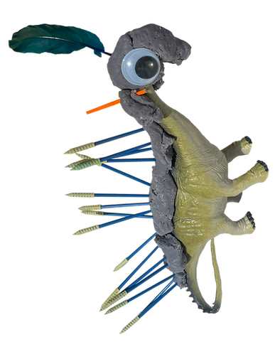 A SciencePlay Kids activity. A plastic dinosaur toy that has playdoh stuck on top of. Accessories have been stuck into the playdon. Such as: spikes, a googly eye and feathers to mimic adaptations. 