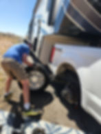 Dave changing tire on the truck outside Albuquerque NM