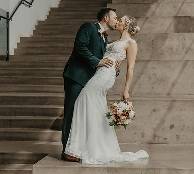 bride and groom bracing in a kiss in edmonton alberta
