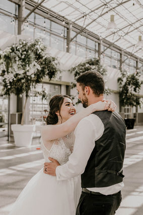 Bride and groom embracing while dancing at the Enjoy Center in St Albert Alberta