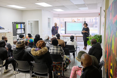 Two members of the Rafkiki team presenting to the community