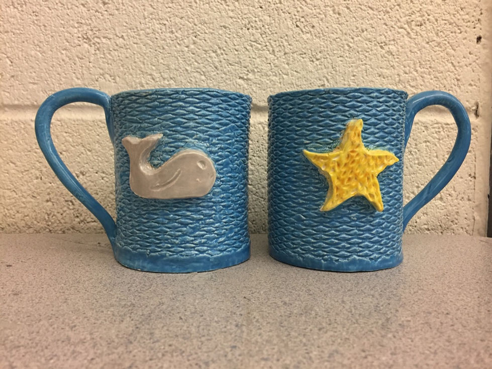 An image of a pair of ceramic mugs