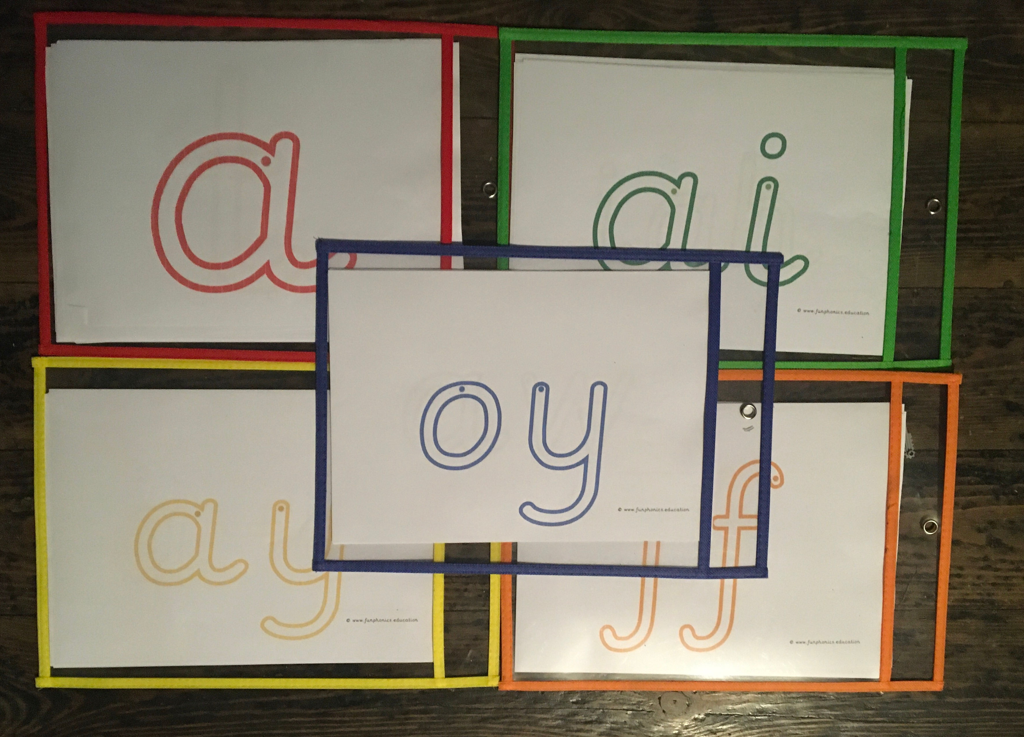 PRE Wipe clean folders with all of the letters & sounds from phases 2,3 &5