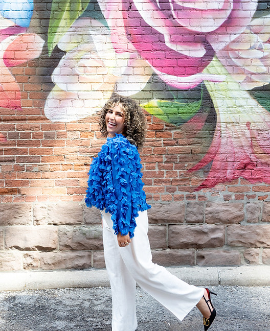 Authentic Gazzy Photoshoot in Downtown Toronto - Wearing a Blue Feather Jacket and White Pants