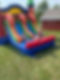 Thumbnail: Kids on multi-colored inflatable bounce house on green grass in Michigan 48880