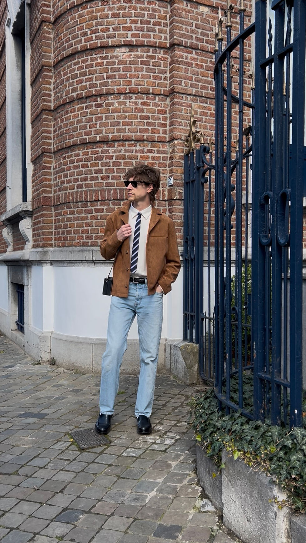 Men’s suede jacket and striped tie