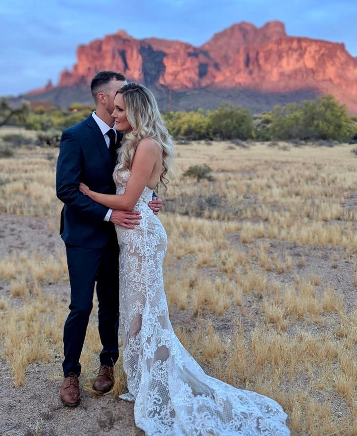 Bride smiling captured in in desert with groom at The Paseo