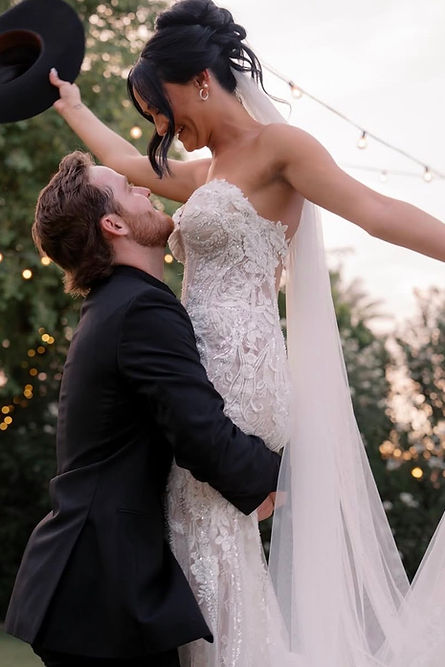 BRIDE AND GROOM LAUGHING IN PHOTO