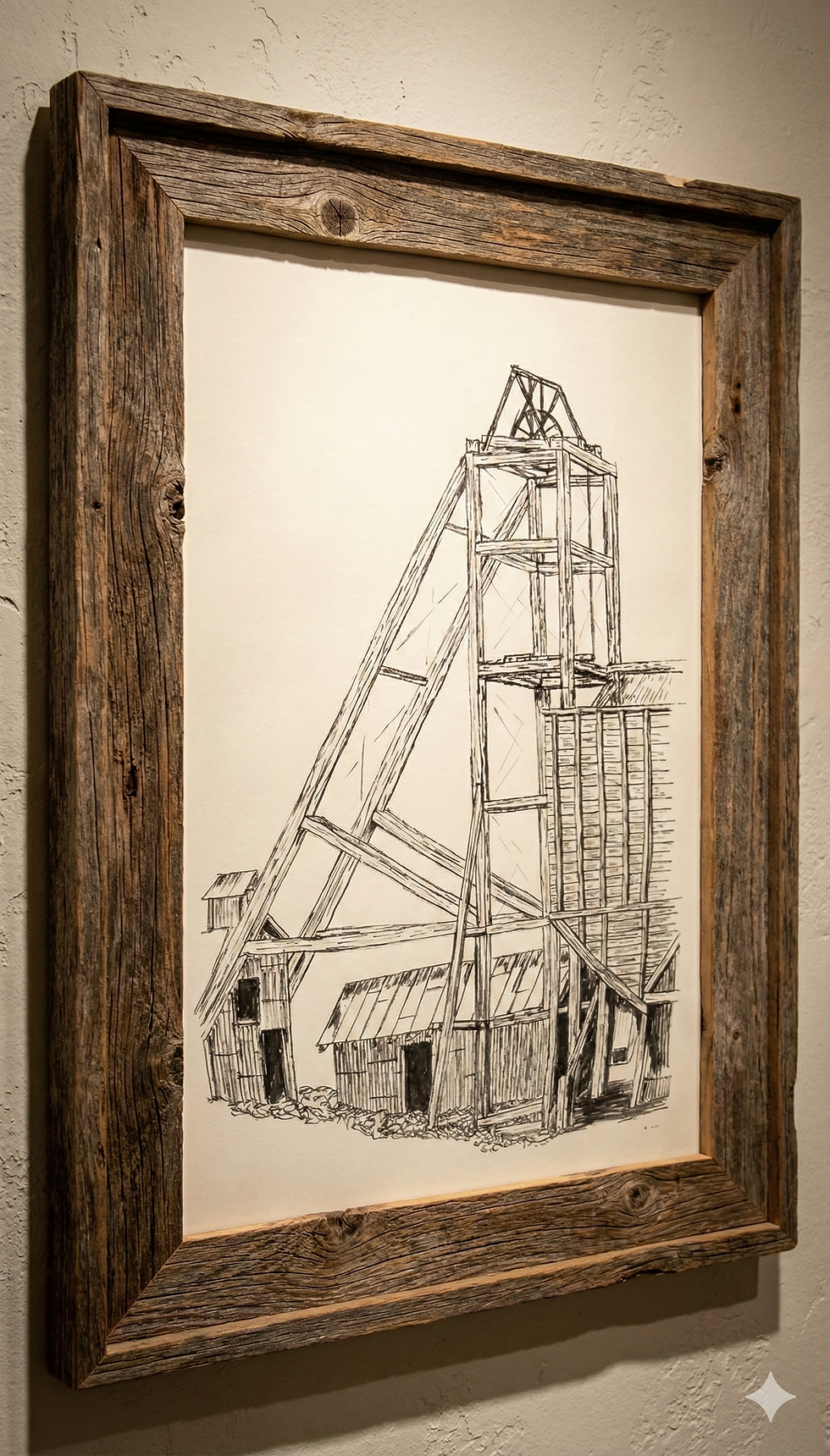 An original graphite pencil drawing by the creator's father, depicting a detailed mining headframe and outbuildings. The sketch is displayed in a rustic, weathered wood frame, serving as the foundational inspiration and namesake for The Graphite Study project.