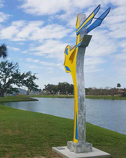public art Yellow dancer sculpture at Tuscawilla Park. Ocala, FL