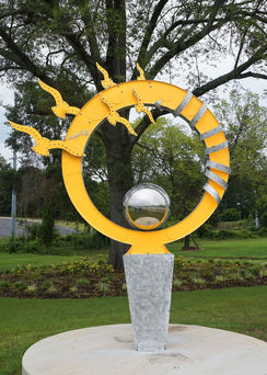 Sunrise sculpture, Public Art, mirror finish Stainless Steel sphere on  sunrise, Aluminum, Enamels.
Public Art, Fayetteville, NC
