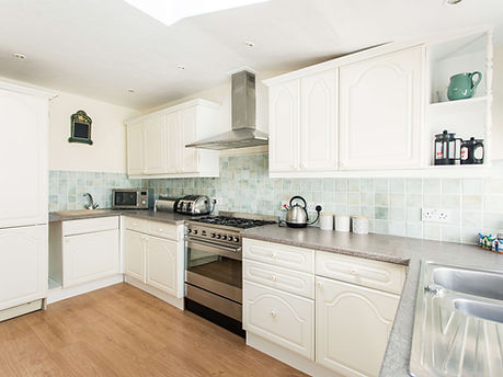Coastal kitchen with range cooker, micowave, kettle and toaster