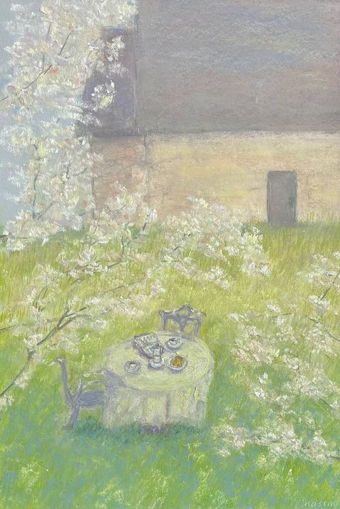 House and the blooming tree in spring in soft pastel in French  garden with the table and the served on it breakfast