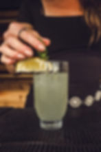 cocktal and lemon wedge