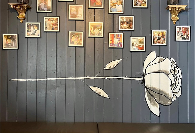 Black and white floral rose mural at Made In Italy, Glen Ellyn, IL by Eric Harold, Owner/Muralist of Headlamp Creative Group