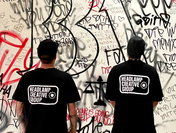 Graffiti-style mural painting by Headlamp Creative Group.