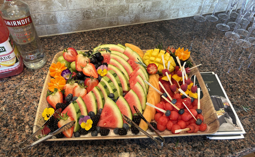 Colorful fruit platter with watermelon, strawberries, and other assorted fruits.