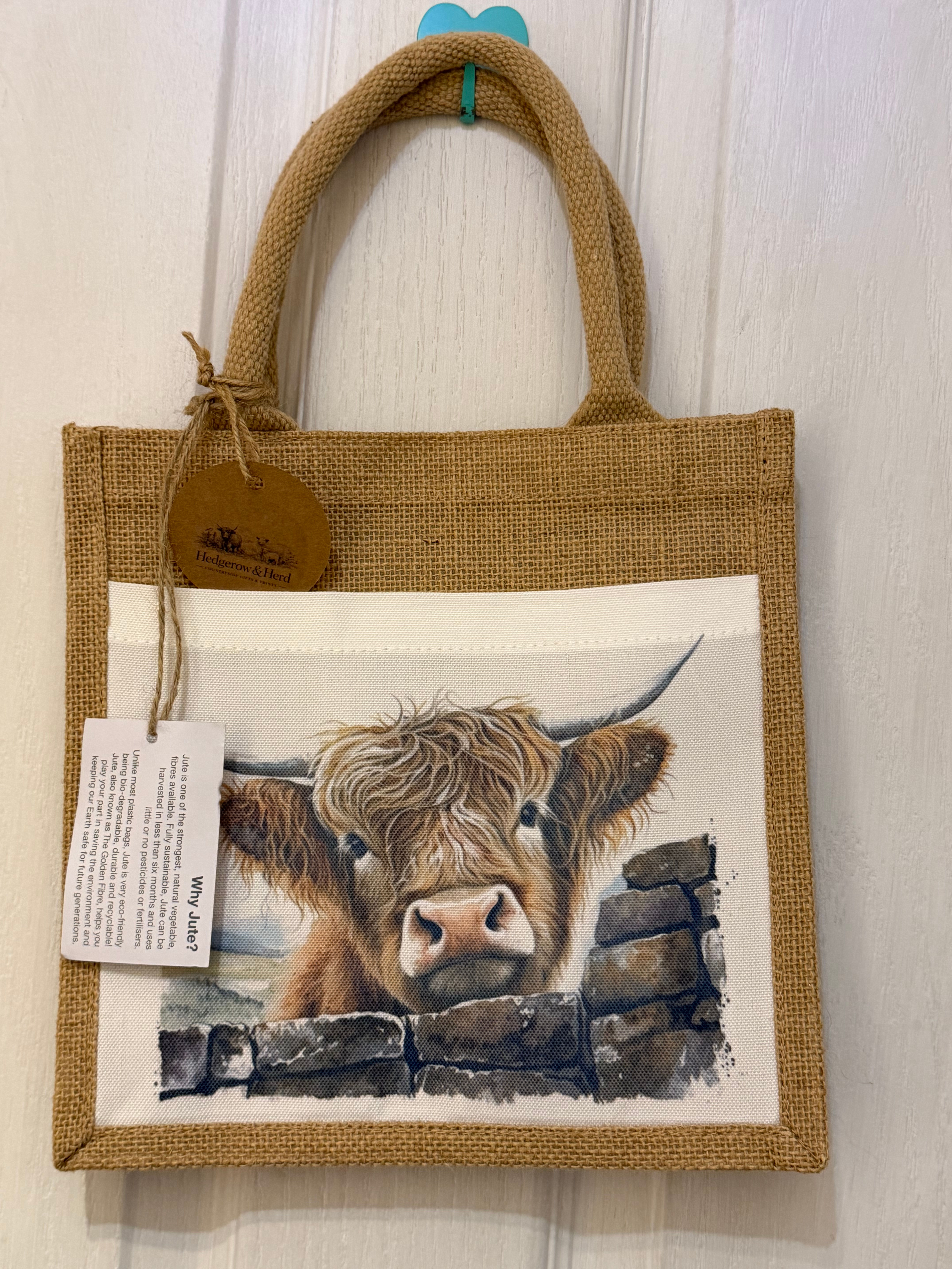Looking over the wall jute tote bag 