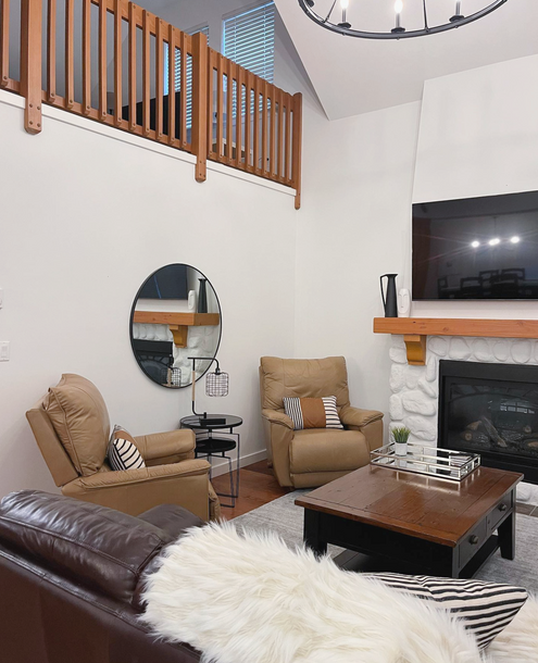 beautiful modern living room with neutral decor, and white walls
