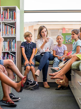 Teacher and Kids in Library