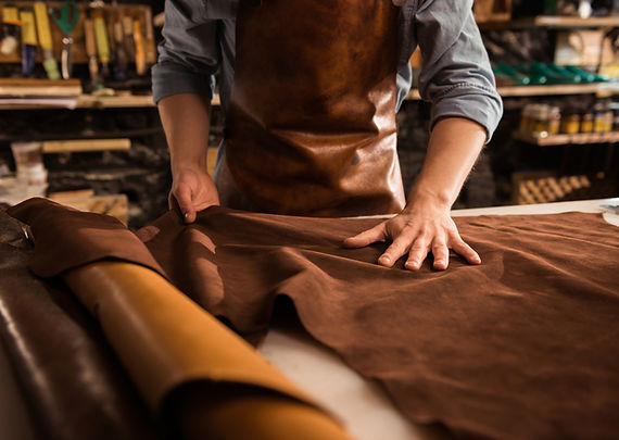 close-up-cobbler-working-with-leather-textile.jpg