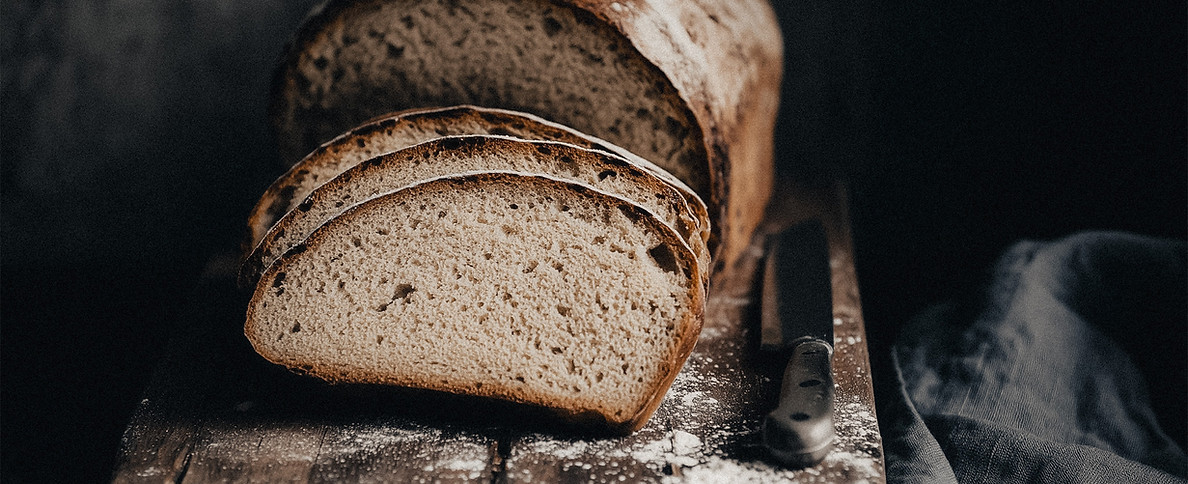Rustic artisan bread on cutting board – food photography