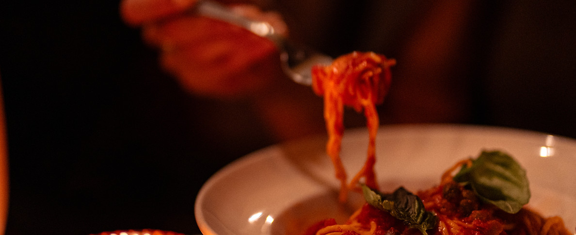 Pasta with tomato sauce on a dinner plate - Food photography