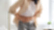 person with Crohns or colitis holding abdomen.jpg