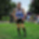 Smiling runner wearing Ease Pocket Shorts at a marathon.
