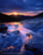 Sunrise at Columbine Falls during a "gap" morning, when the sun finds a narrow, clear gap between dense clouds and the horizon